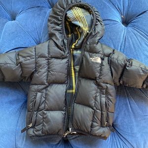 Kid’s black North Face puffer jacket